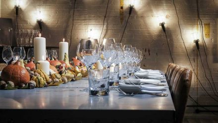 Dine at a Zinc banqueting table in a beautiful warehouse-style setting just feet away from an impressive commercial kitchen. 