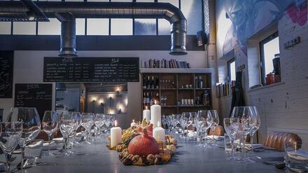 Dine at a Zinc banqueting table in a beautiful warehouse-style setting just feet away from an impressive commercial kitchen. 