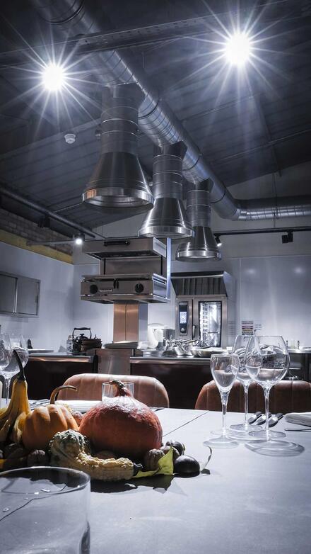 Dine at a Zinc banqueting table in a beautiful warehouse-style setting just feet away from an impressive commercial kitchen. 